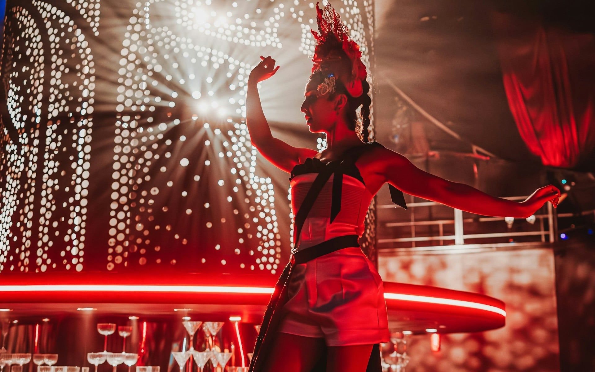 Performer on stage during Come Alive Westend show with dramatic lighting