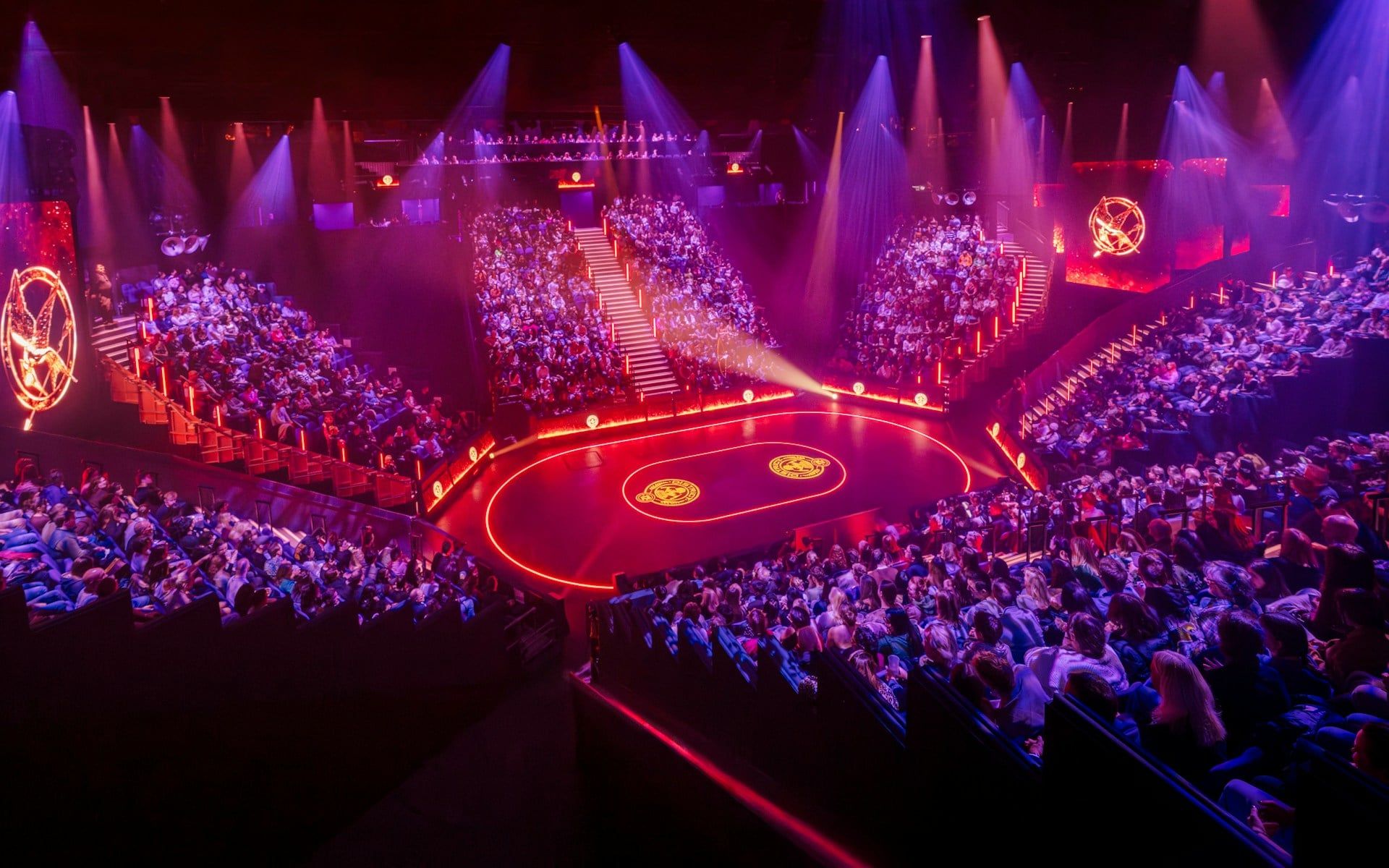 Hunger Games West End show stage with audience in a circular theater setting — The Hunger Games