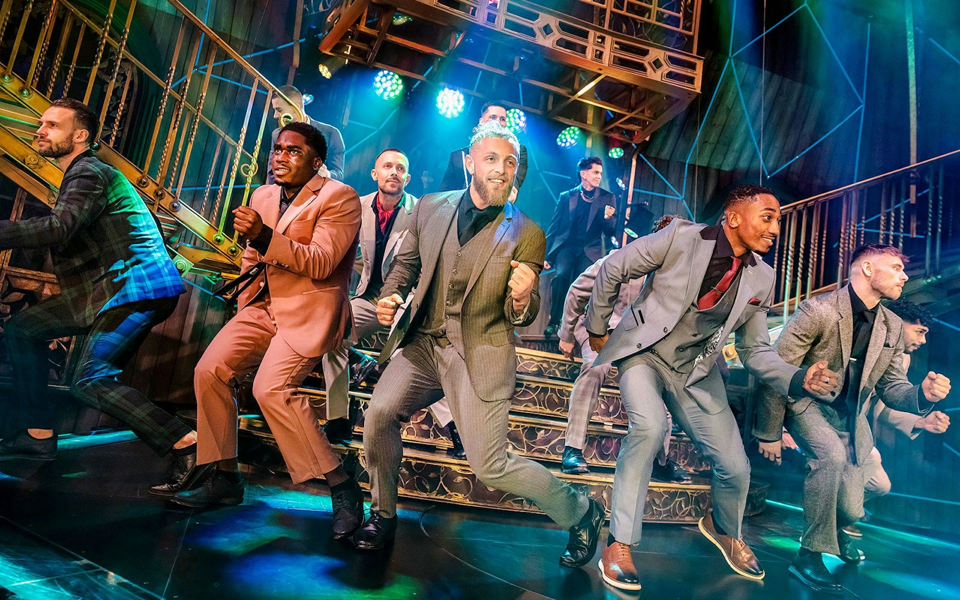 Performers dancing energetically on stage during Magic Mike Live show