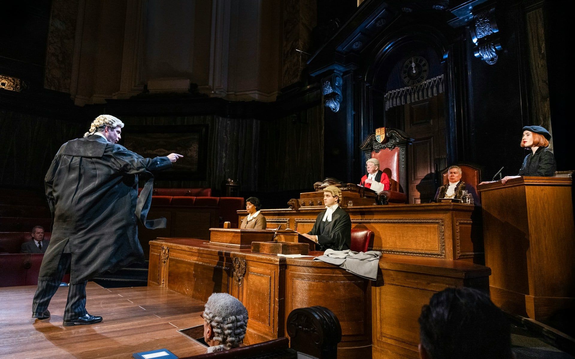 Courtroom scene from "Witness for the Prosecution" performance with actors in period costumes