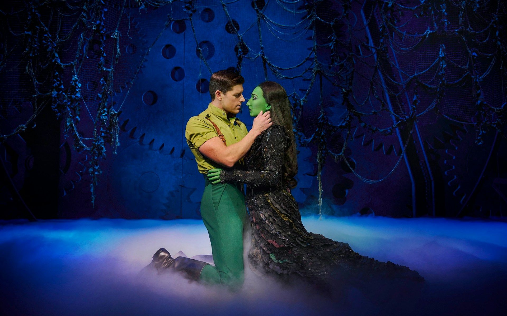 Actors in a dramatic scene from the musical Wicked on stage