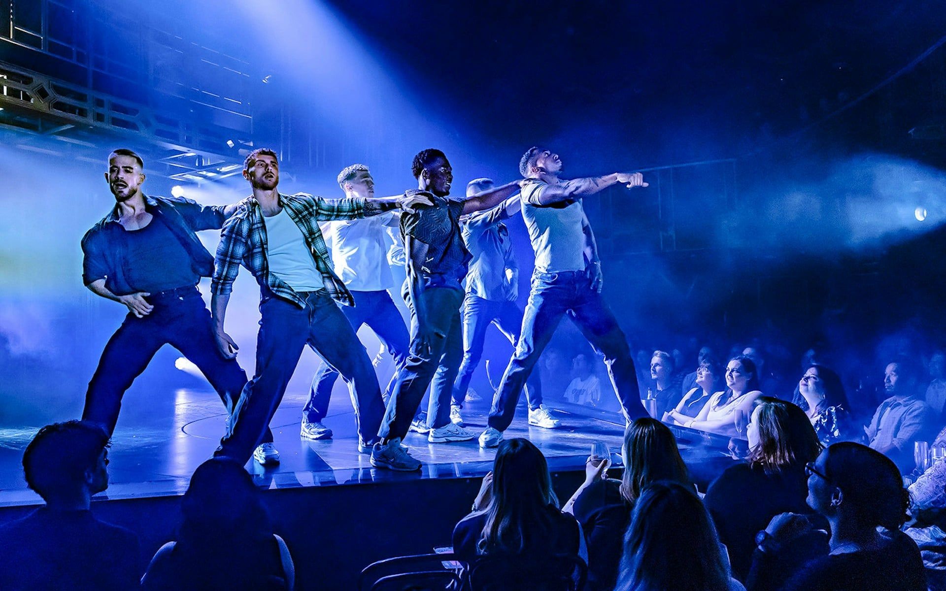 Performers dancing on stage during Magic Mike Live show