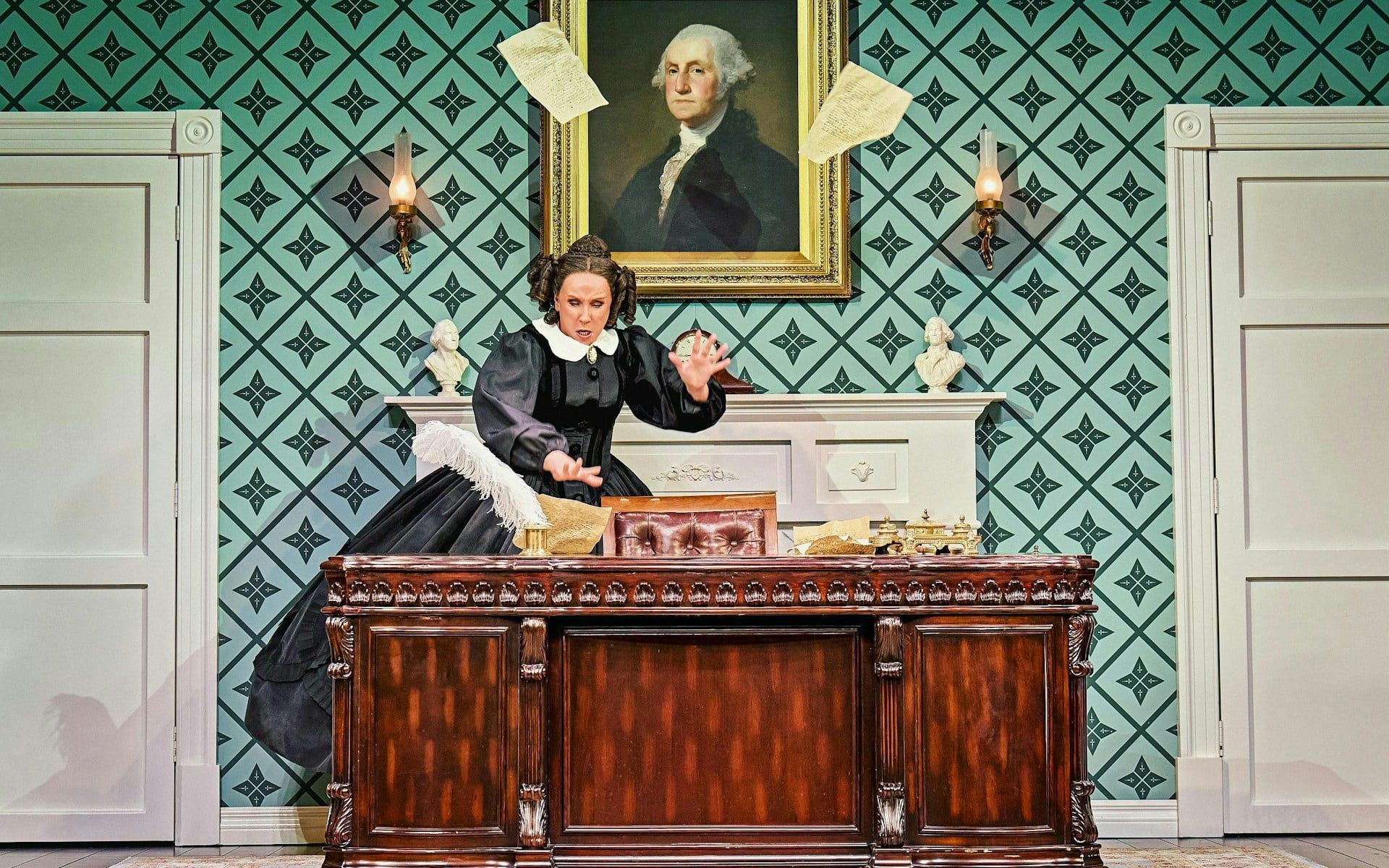 Stage scene from Oh, Mary Westend show with actor at desk, papers flying
