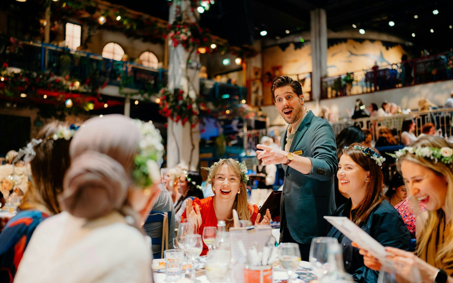 Guests enjoying dinner and entertainment at Mamma Mia! The Party event