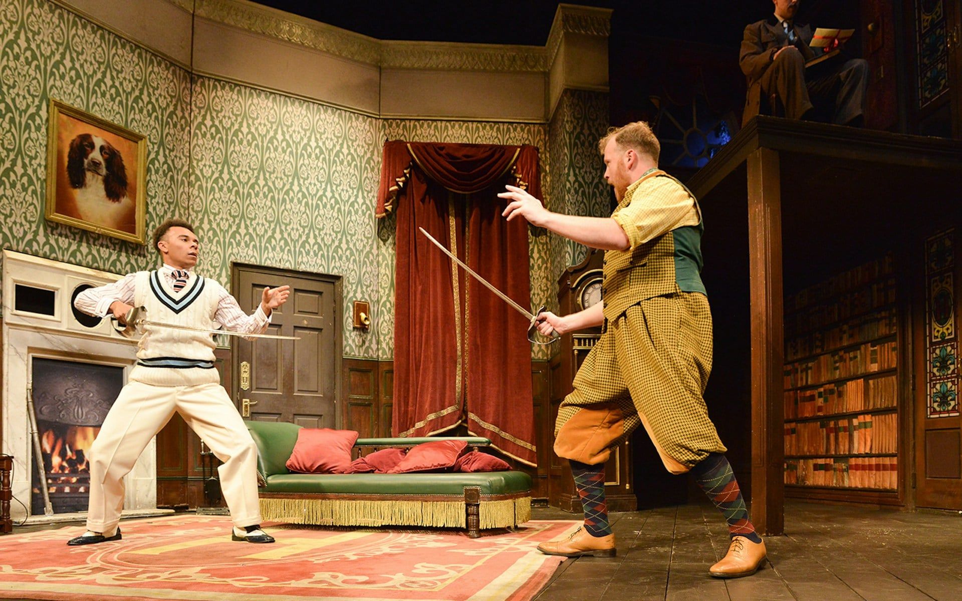 Actors in a comedic sword fight on stage during "The Play That Goes Wrong