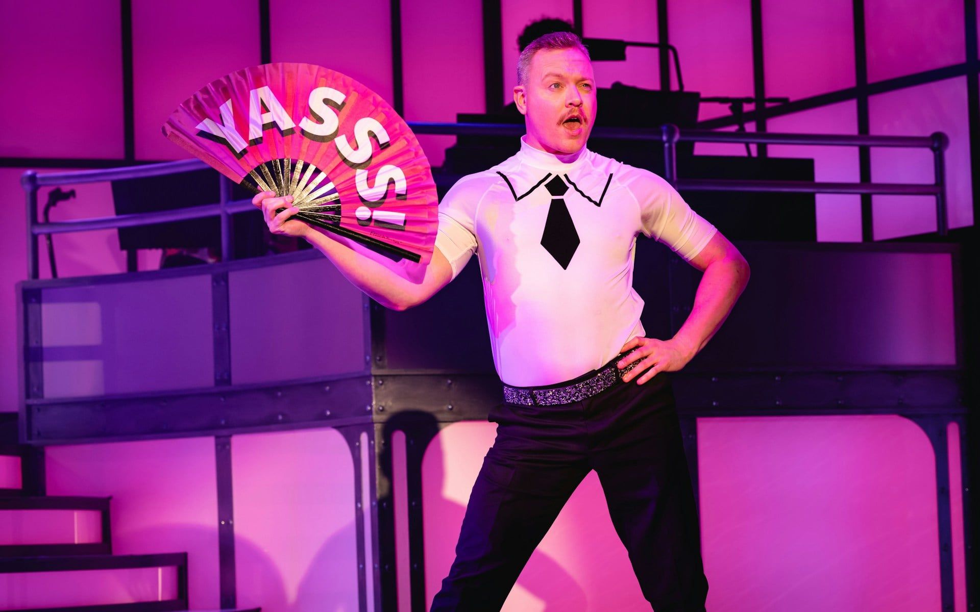 Performer on stage with a fan during Titanique Westend show