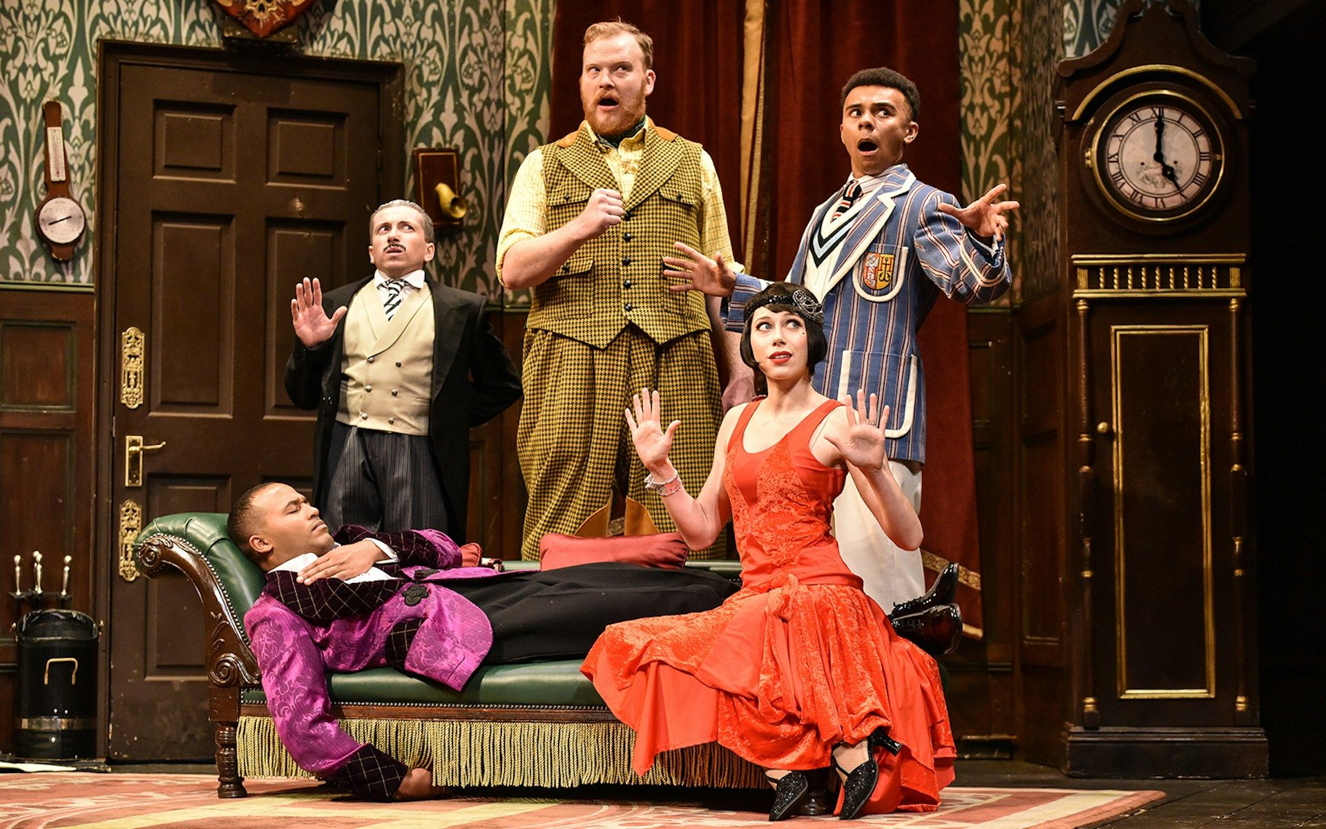 Actors performing a comedic scene in "The Play That Goes Wrong" on stage
