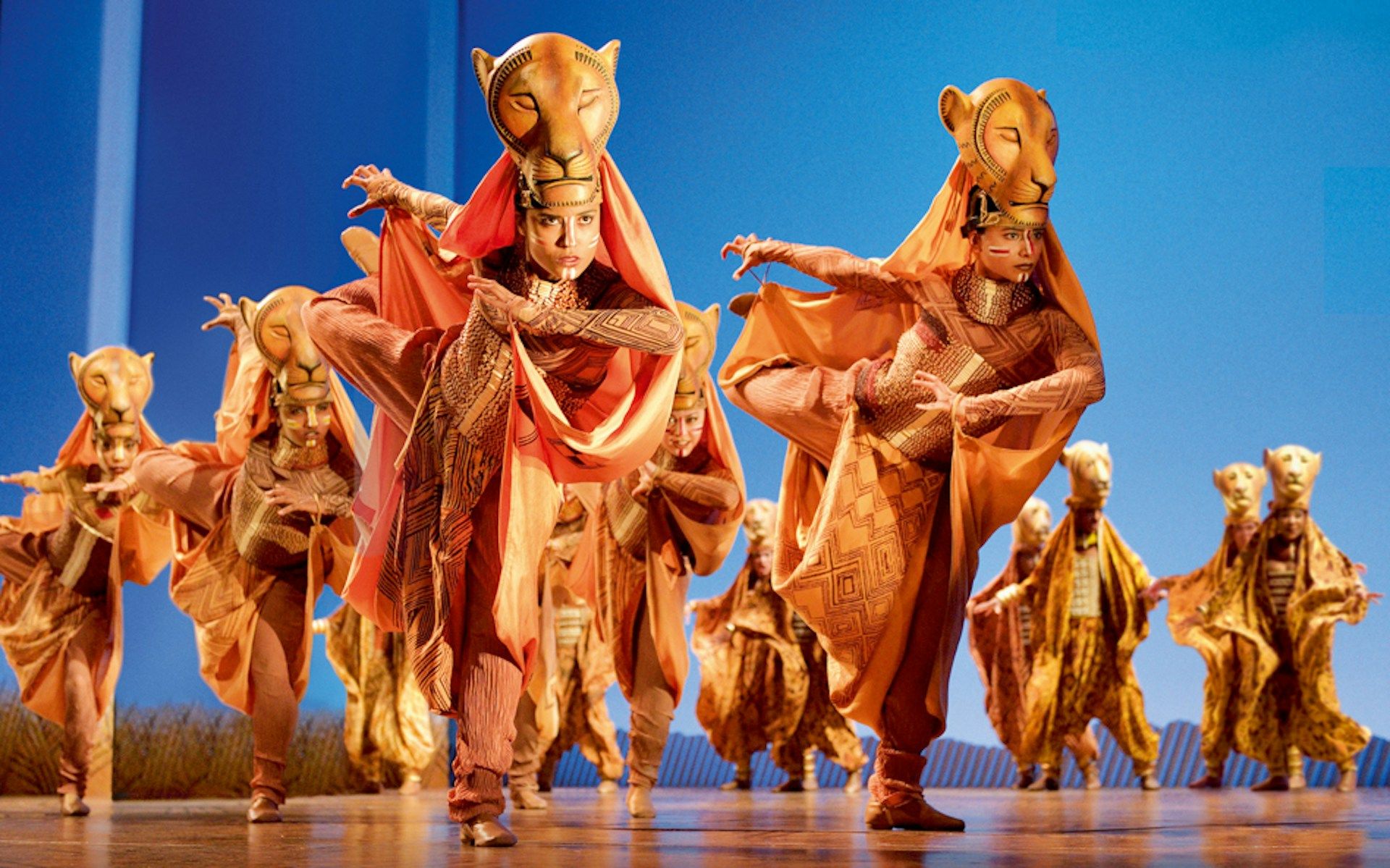 Performers in lion costumes on stage during The Lion King show in London
