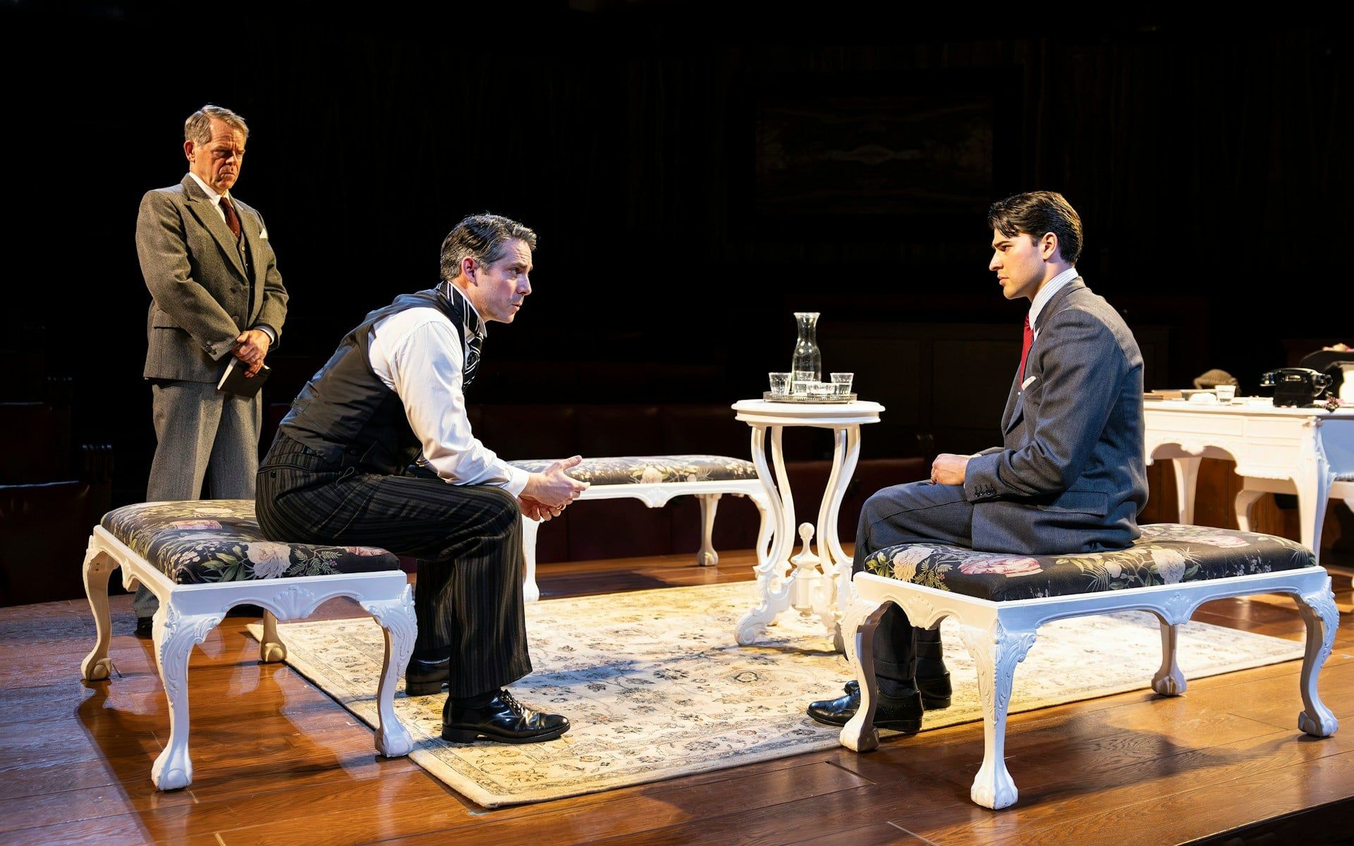 Courtroom scene from "Witness for the Prosecution" with three actors in period costumes