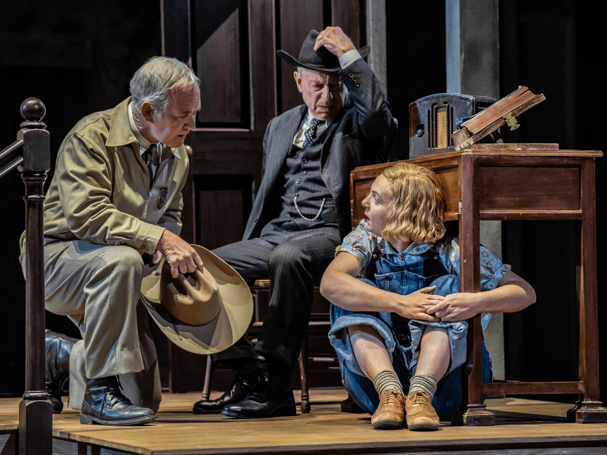 Actors performing a scene from "To Kill a Mockingbird" on a West End stage