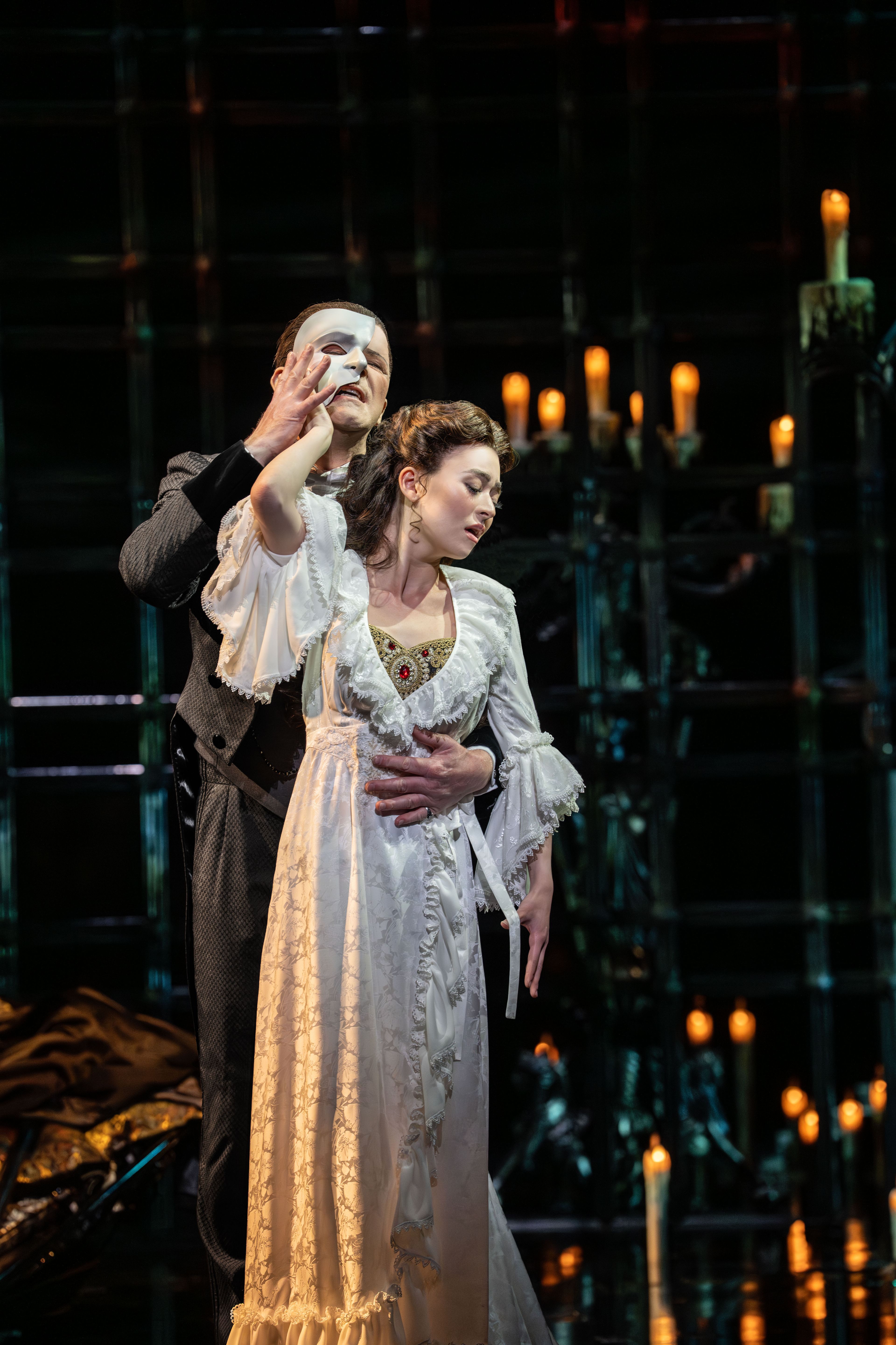 The Phantom and Christine in a candlelit embrace, The Phantom of the Opera. Photo by Johan Persson