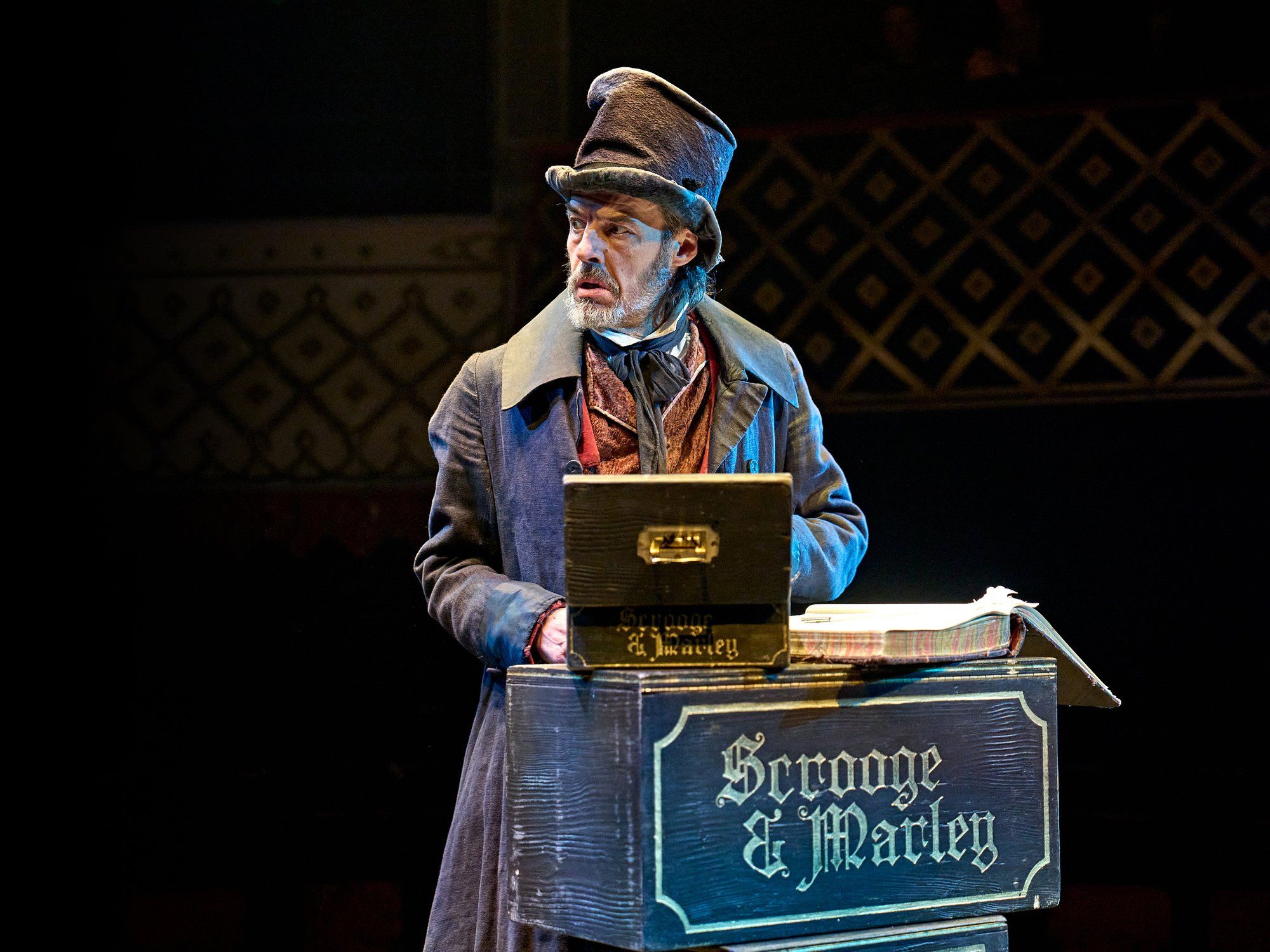 A Christmas Carol at The Old Vic (previous year's production): Scrooge at the Scrooge and Marley counting-house desk. Photo: Manuel Harlan