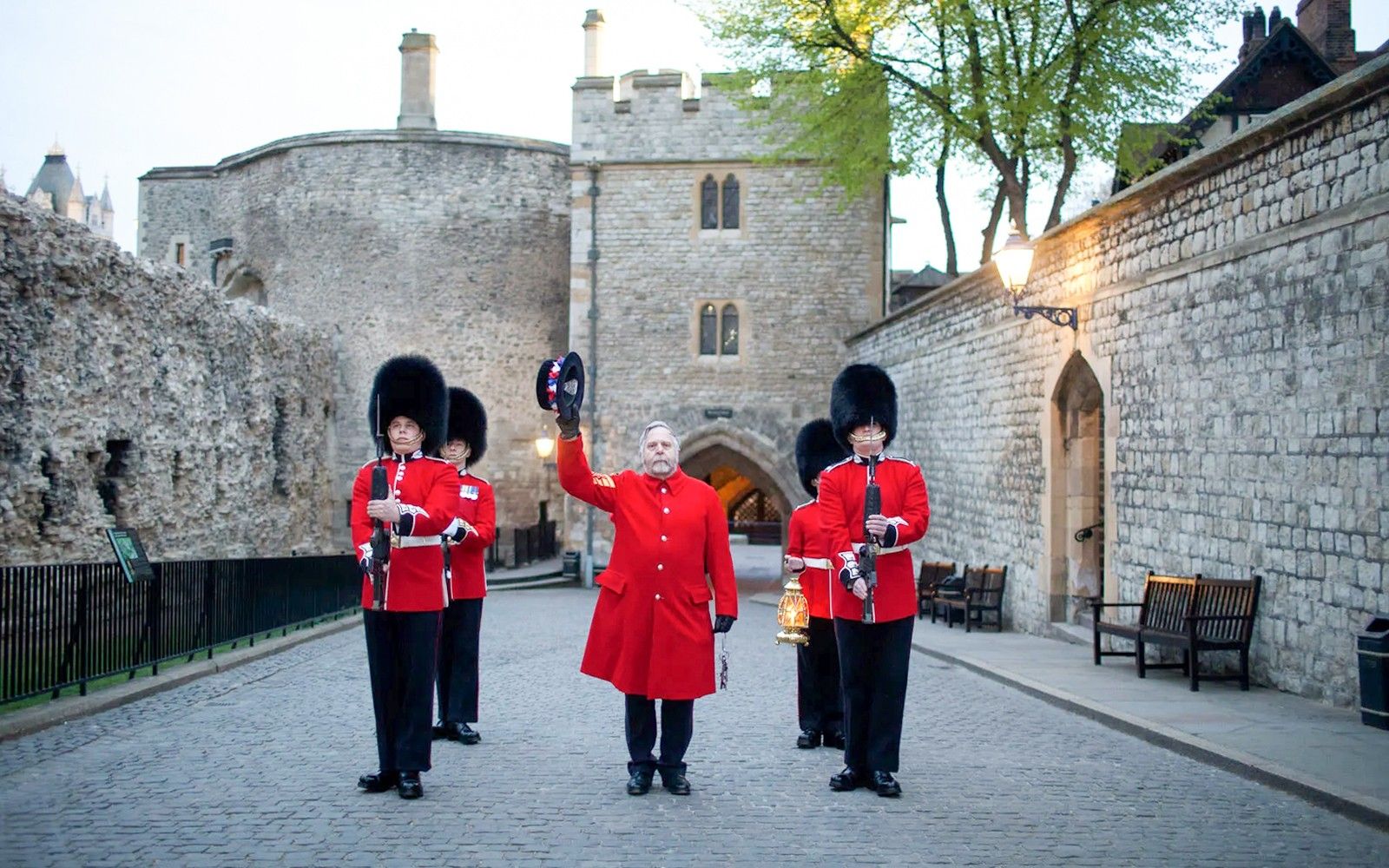 Guards in red uniforms at Tower of London during Ceremony of the Keys.