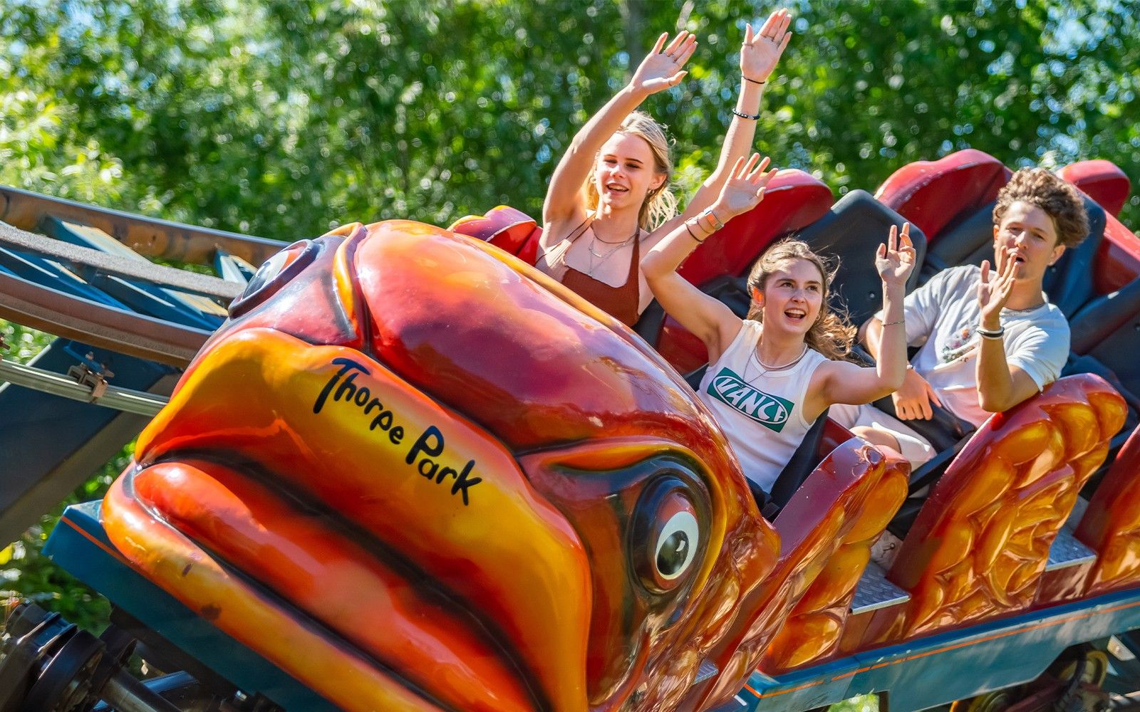 Flying Fish Ride at Thorpe Park with families enjoying the roller coaster.