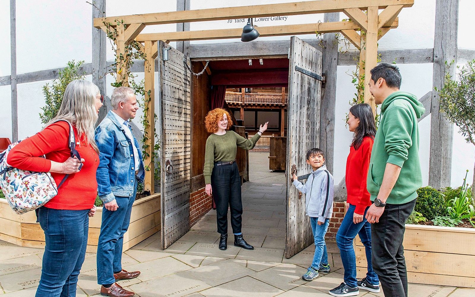 Guide welcomes visitors for the tour
