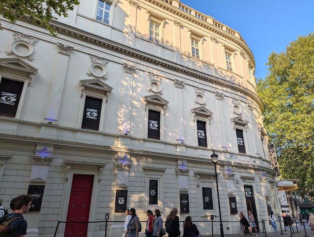 Cabaret cast performing live on stage at the London West End theatre