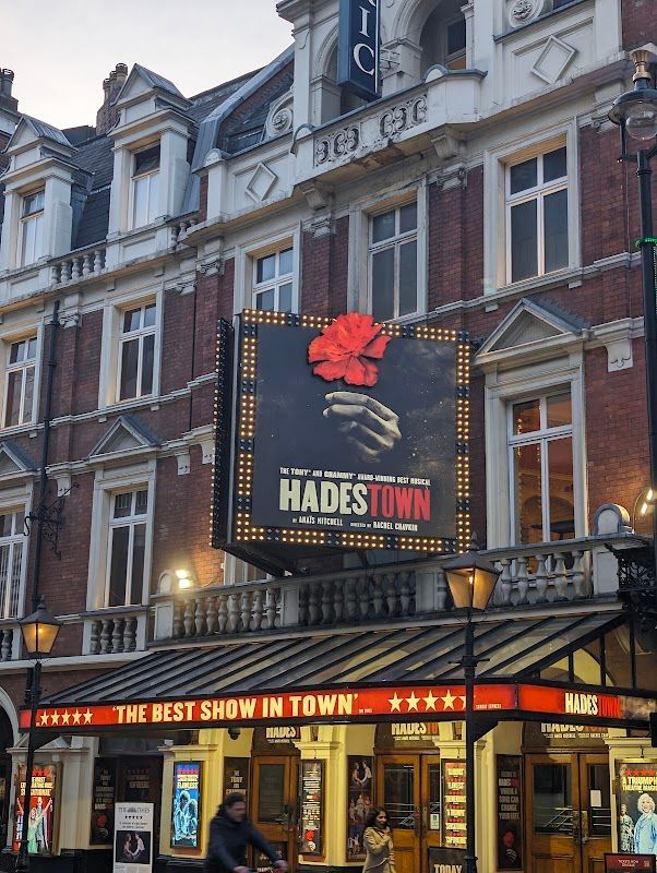 Hadestown cast performing live on stage at the London West End theatre
