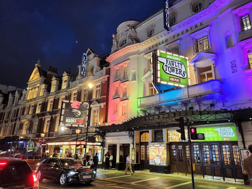 Hadestown scene from the West End production featuring the ensemble cast