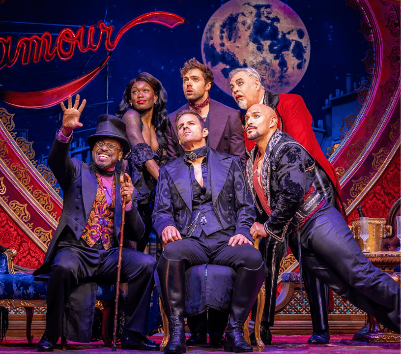 Moulin Rouge! The Musical ensemble cast performing a showstopping musical number