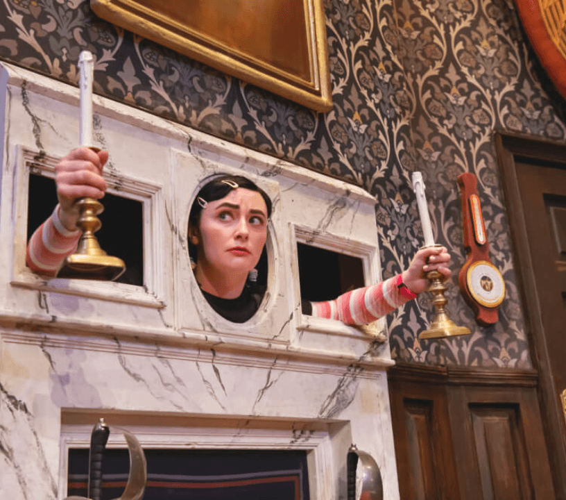 The Play That Goes Wrong ensemble cast performing a showstopping musical number