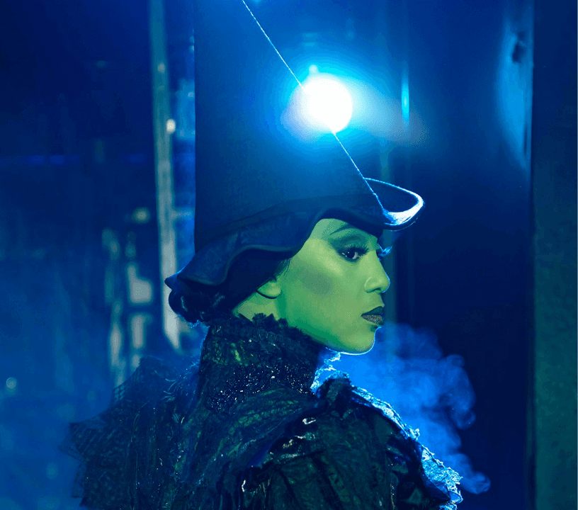 Wicked ensemble cast performing a showstopping musical number