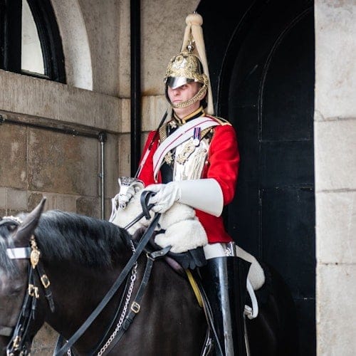 Tour group walking past royal landmarks in central London on a guided royal history walk