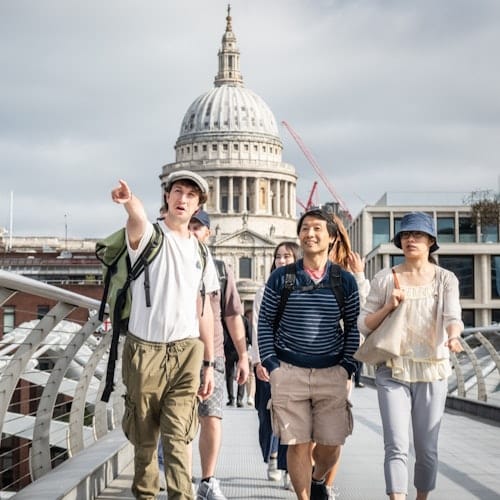 Visitors approaching the dome of St Paul's Cathedral on a guided London walking tour
