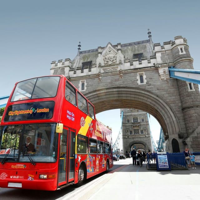 Open-top City Sightseeing bus passing Big Ben on the London hop-on hop-off Red Route
